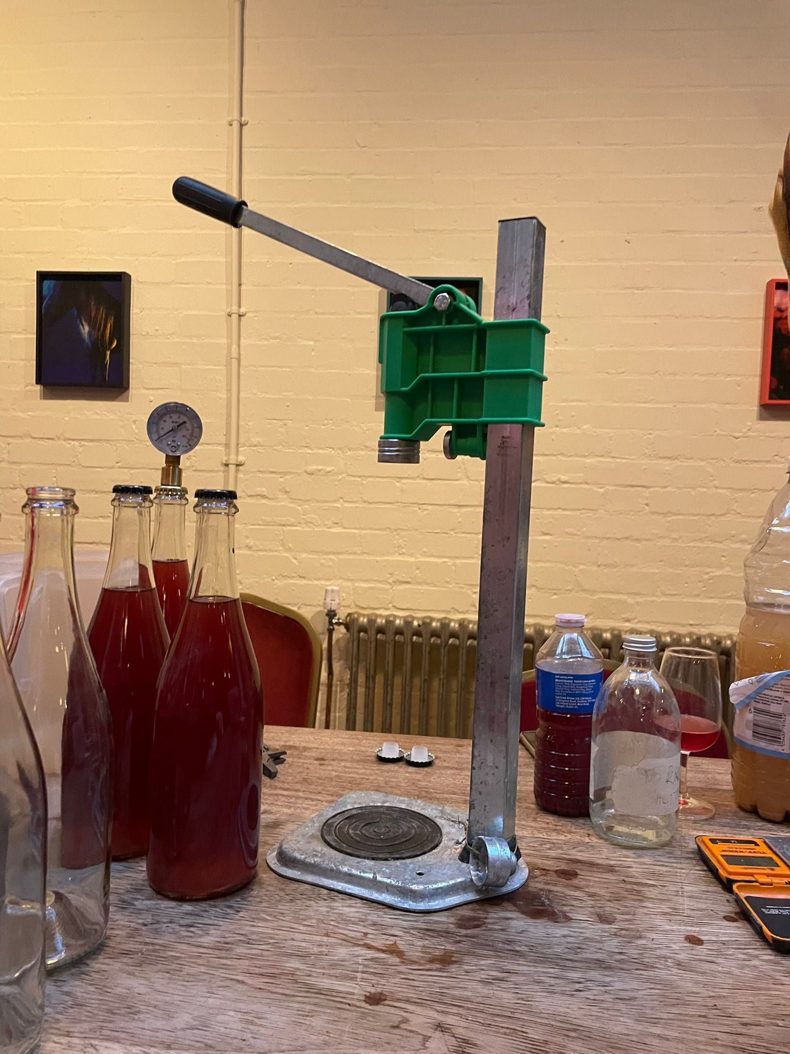 Crown capping machine and bottles of red Pet Nat at the Numbers Winery workshop